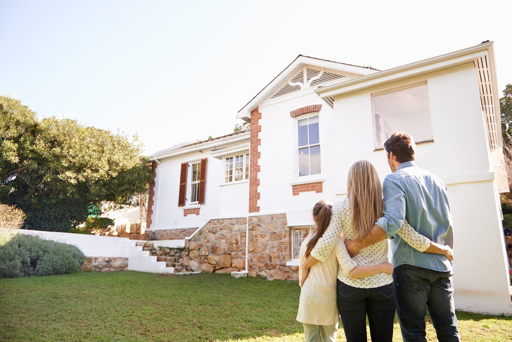 Family looking at their new home